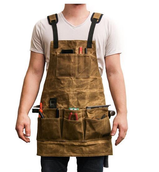 Tablier de travail. Tablier à outils en toile cirée avec plusieurs poches pour hommes et femmes